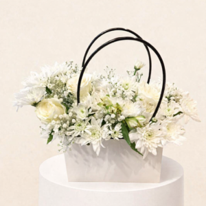 A Bouquet Of White Roses In An Elegant Bag 🤍